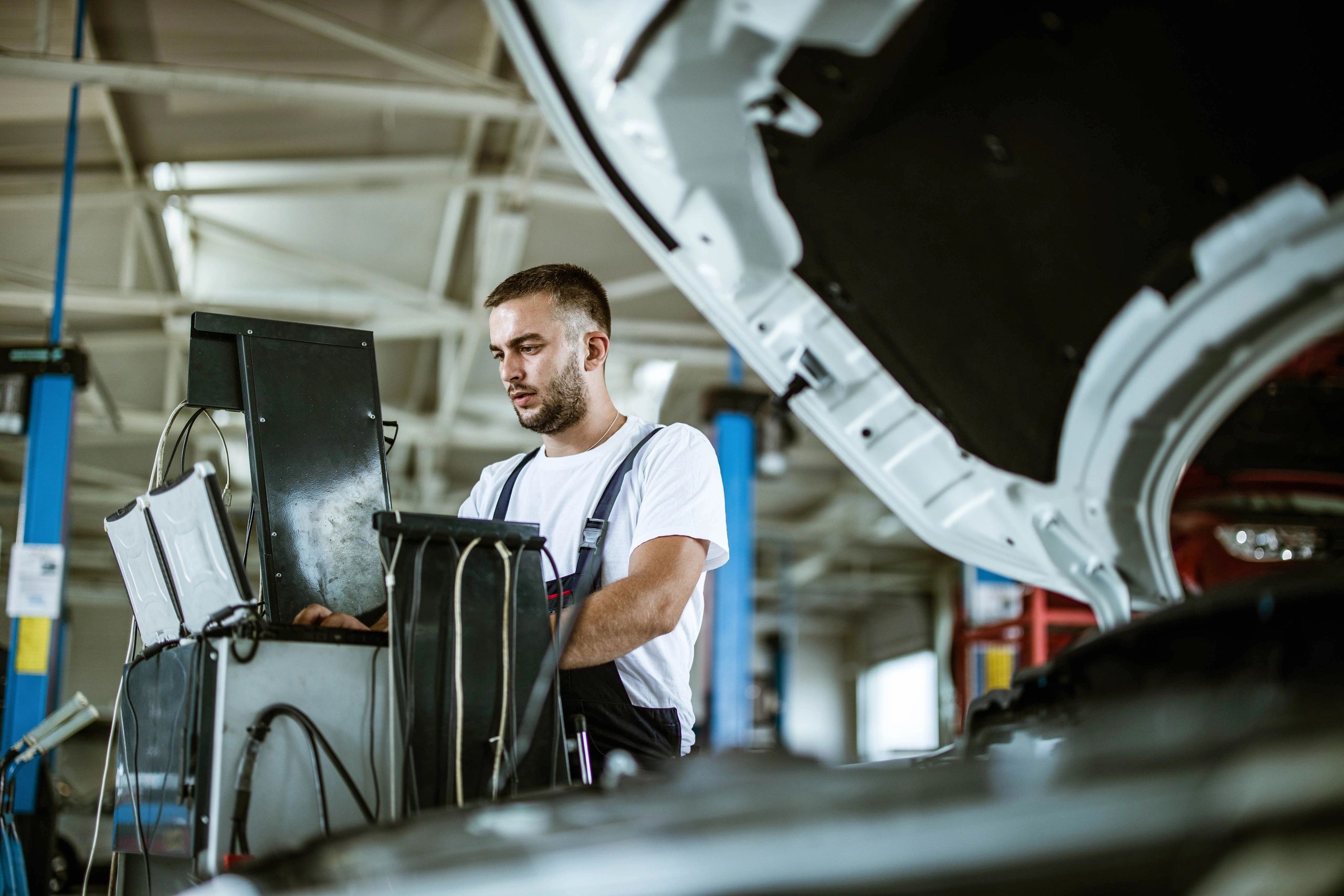 Mechanic using a computer for vehicle diagnostics