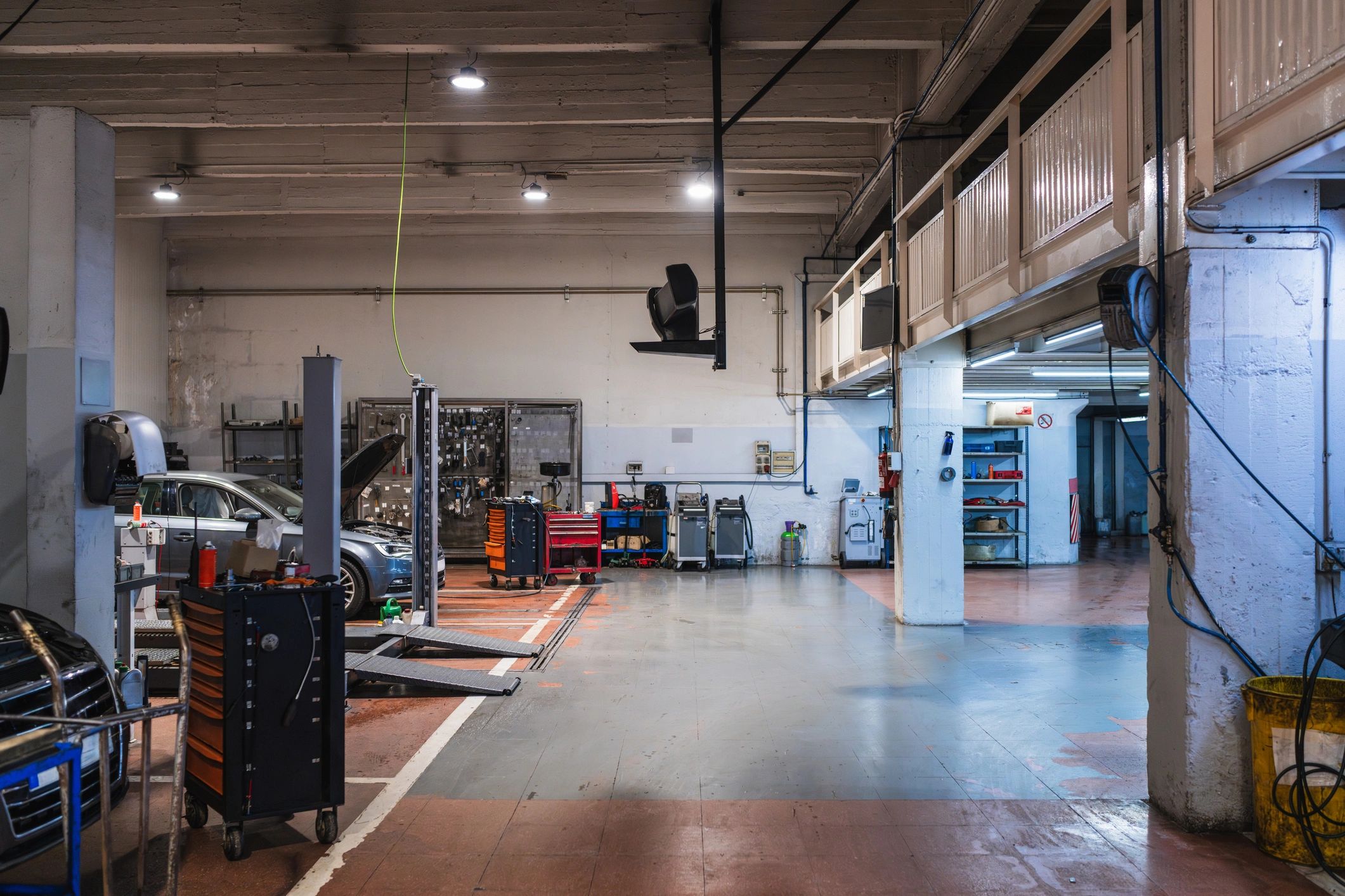 Wide view of a professional auto repair shop with vehicle lifts