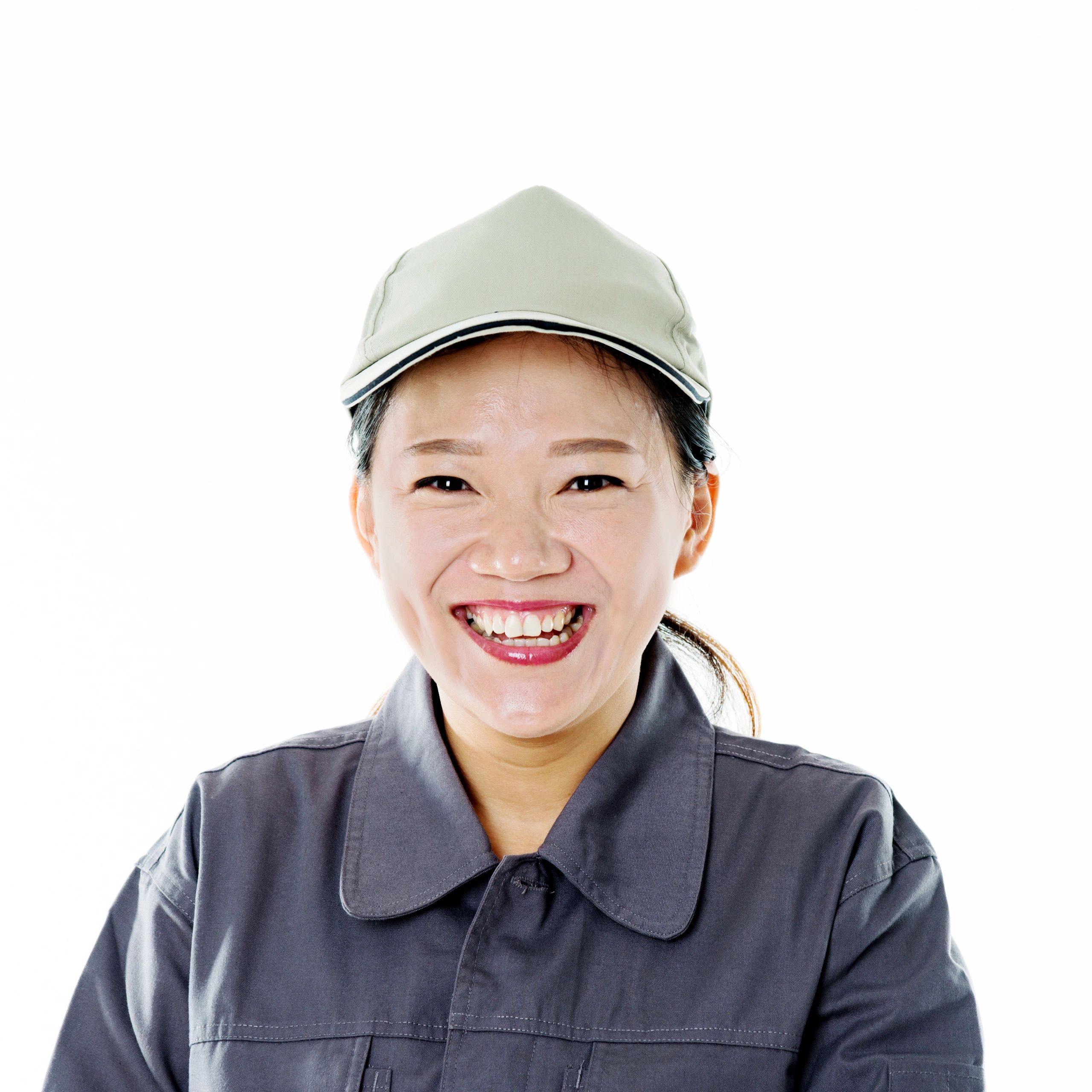 Portrait of a lead auto technician in a gray uniform